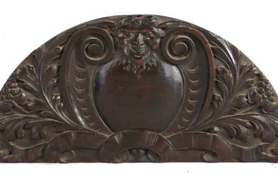 17th Century oak architectural carving, possibly a door pediment, the arched panel designed with
