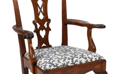 GEORGIAN IRISH-STYLE ARMCHAIR Ornate pierced vasiform splat. Armrests carved with eagle's heads at terminals. Slip seat with blue an..