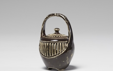 A small lidded jar. 19th/20th century