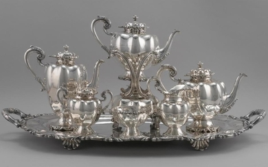 MEXICAN STERLING SILVER TEA AND COFFEE SERVICE Consists of a melon-form hot water kettle-on-stand with burner, a coffeepot, a teapot...