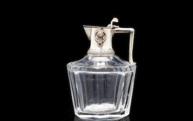A small silver mounted glass decanter