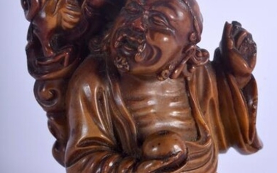 A 19TH CENTURY CHINESE CARVED SOAPSTONE FIGURE OF AN