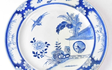 A 19th century Chinese blue and white charger painted with...