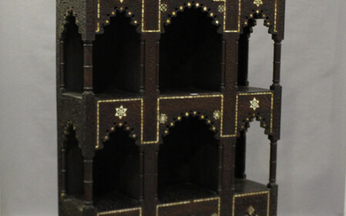 A 19th century Middle Eastern hardwood display shelf, profusely carved and inlaid in mother-of-pearl