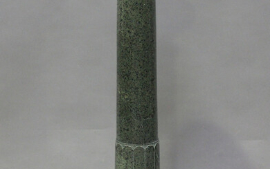A 20th century green serpentine sectional display pedestal, raised on an octagonal base, height 111c