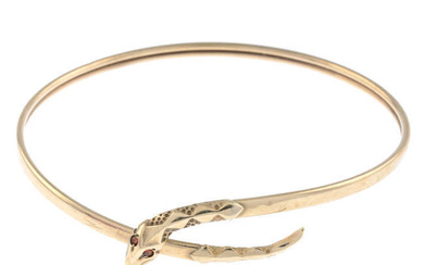 A 9ct gold snake cuff bangle, with garnet eye detail