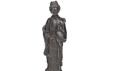 A BRONZE FIGURE OF A LADY HOLDING A SMALL ANIMAL...