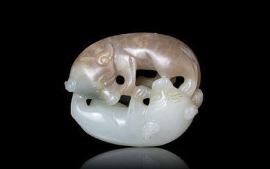 A BROWN AND WHITE JADE ‘DOUBLE-BADGERS’ CARVING, SHUANGHUAN...