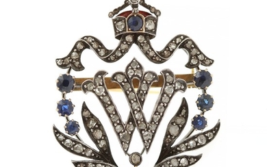 A Belle Époque sapphire and diamond brooch set with eight old-cut sapphires, numerous rose-cut diamonds and red enemal, mounted in 14k gold and silver.