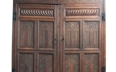A CARVED OAK WARDROBE OR PRESS CUPBOARD, LATE 17TH CENTURY AND LATER