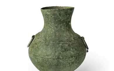 A Chinese archaic bronze vessel, hu, Han dynasty, the rounded body cast...