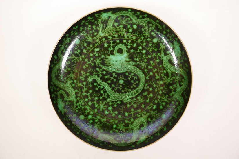 A Chinese black glazed dish with green dragon decoration, 6 ...