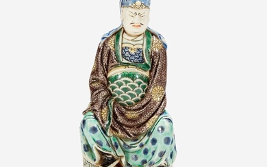 A Chinese famille verte-decorated Dehua porcelain figure of Guandi 德化窑五彩关帝像 The figure probably 18th century, the enamels possibly later 关帝像为十八世纪 珐琅或为后添