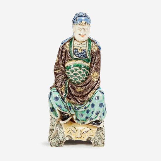 A Chinese famille verte-decorated Dehua porcelain figure of Guandi 德化窑五彩关帝像 The figure probably 18th century, the enamels possibly later 关帝像为十八世纪 珐琅或为后添