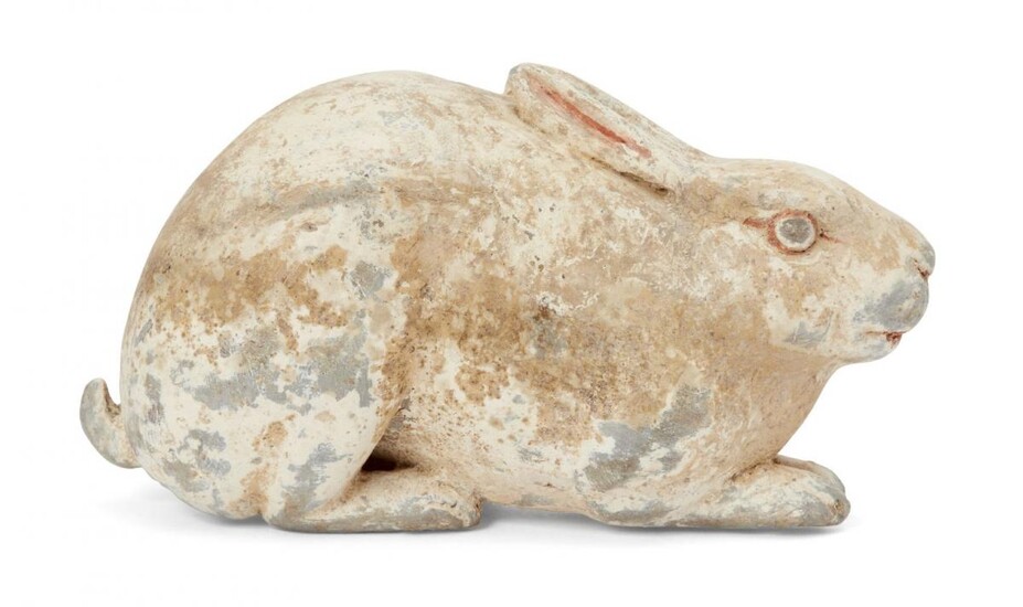 A Chinese grey pottery hare, Han dynasty, modelled crouching facing...