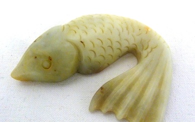 A Chinese jade figure of a carp fish, modelled with head and...