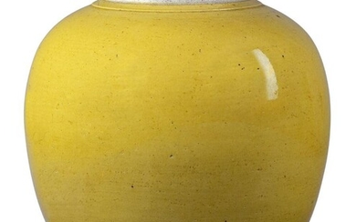 A Chinese porcelain monochrome yellow-glazed jar, Jiaqing period, of ovoid form, covered in an egg-yolk yellow glaze, the rim unglazed, 21.5cm high Provenance: Private North London collection