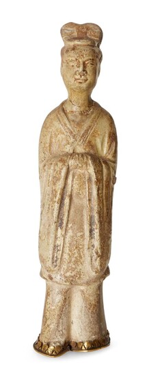 A Chinese straw-glazed figure of a lady, Sui-Tang dynasty, modelled standing with high piled hair, wearing a robe with wide sleeves, with metal mount to base, 19cm high 隋-唐 米黃釉侍女像