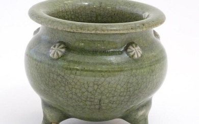 A Chinese three footed censor with a crackle glaze and