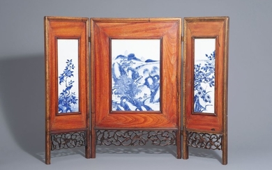 A Chinese threefold wooden screen with blue and...