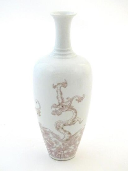 A Chinese vase decorated with a dragon amongst stylised