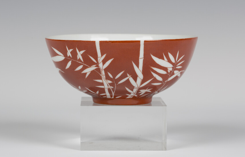 A Chinese white on coral ground hemispherical porcelain bowl, mark and period of Daoguang, the iron