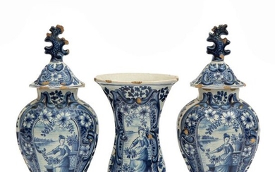 A Delft blue and white pottery three piece garniture set
