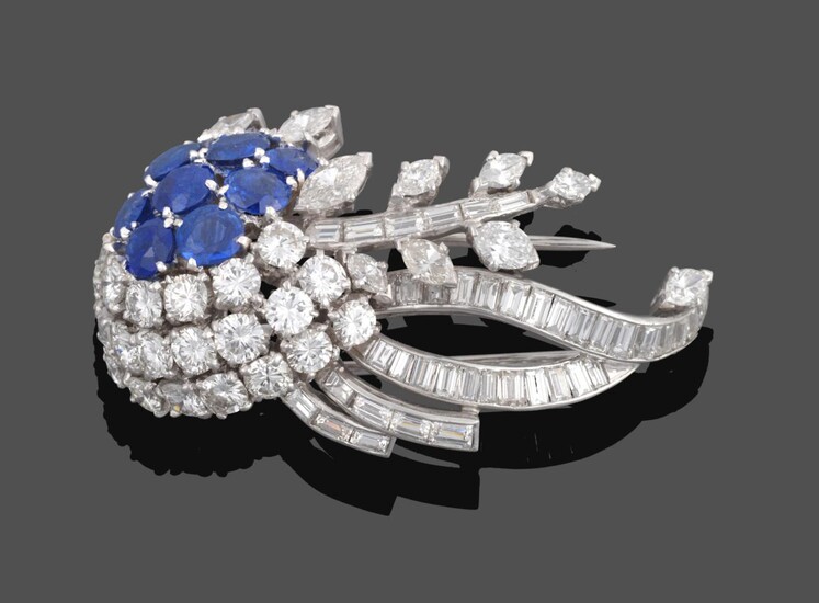 A Diamond and Sapphire Brooch, circa 1950, of stylised floral form set with round cut...