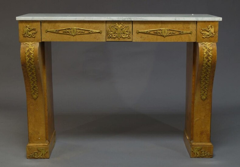 A French Empire style burr walnut and ormolu mounted console...