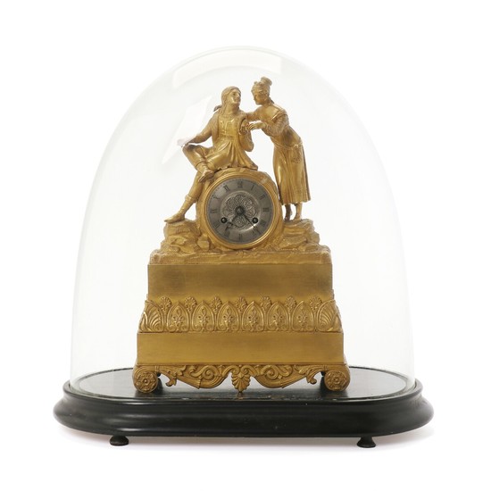 A French figural gilt bronze mantel clock adorned with young couple. Second half of the 19th century. H. 35 cm. W. 24 cm. D. 8,5 cm.