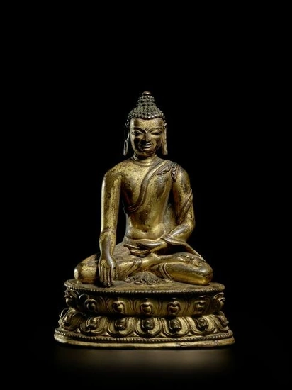 A GILT COPPER ALLOY FIGURE OF BUDDHA TIBET, 13TH/14TH CENTURY