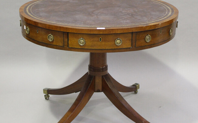 A George III mahogany drum-top library table, the top inset with gilt-tooled brown leather above a s