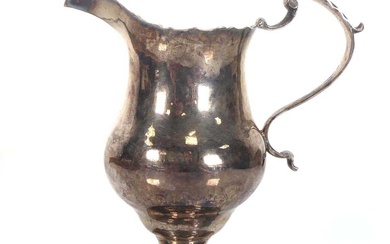 A George III silver cream jug with c-scroll handle, maker...