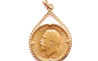 A George V full sovereign dated 1911, claw set to a 9ct pend...