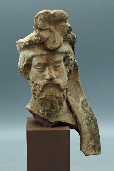 A Greek terracotta head of a bearded man