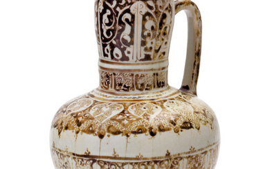 A KASHAN POTTERY JUG, CENTRAL IRAN, EARLY 13TH CENTURY