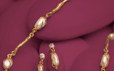 A KESHI PEARL AND GOLD DEMI-PARURE