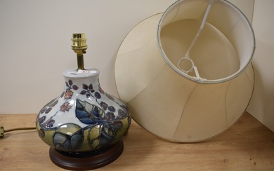 A Moorcroft Pottery 'Bramble' patterned table lamp, tube lined in the typical manner with fruiting