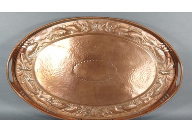 A Newlyn Arts and Crafts copper tray of oval form embossed w...