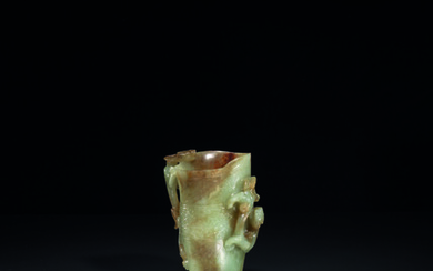 A PALE GREYISH-GREEN AND RUSSET JADE ARCHAISTIC 'CHILONG' CUP