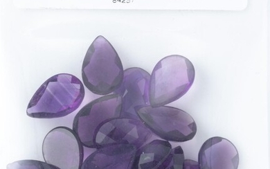 A PARCEL OF UNSET AMETHYSTS; 26 chequerboard cut pear shape gemstones totalling 57.63ct.