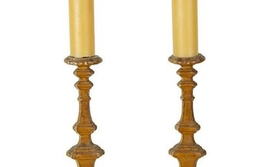 A Pair of Italian Giltwood Prickets Height 25 inches.