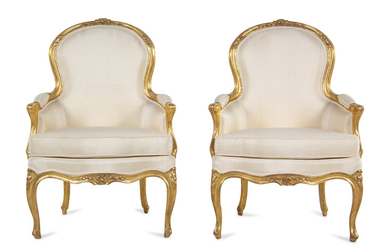 A Pair of Louis XV Carved Giltwood Bergères