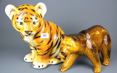 A Portuguese large porcelain figure of a tiger cub, together with a porcelain figure of a bear, tiger H. 29cm.