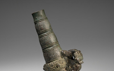 A RARE ARCHAIC BRONZE HANDLE FOR A BELL, YONG Eastern...