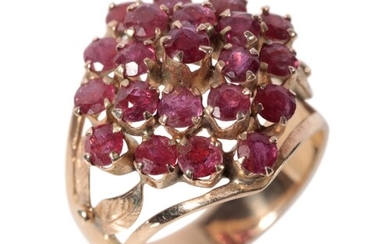 A RED GEM-SET CLUSTER RING raised set on a yellow gold shank...