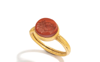 A Roman Gold and Red Jasper Ring Stone with a Portrait Head of an Athlete