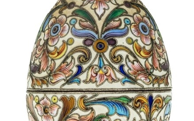 A Russian cloisonne enamel egg, mark of Feodor RÃ¼ckert, Moscow, 1899-1908, 88 standard, assay master Ivan Lebedkin, the egg enamelled with polychrome flowers and leaves against a cream ground, the two halves opening to reveal a gilded interior...