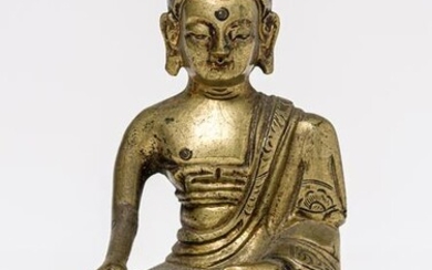 A SINO-TIBETAN BRONZE BUDDHA SHAKYAMUNI, remains