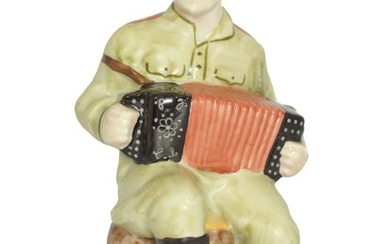 A Soviet Porcelain WWII Figurine Soldier Playing